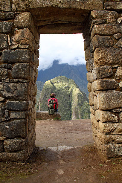 lonely girl in a stone arch