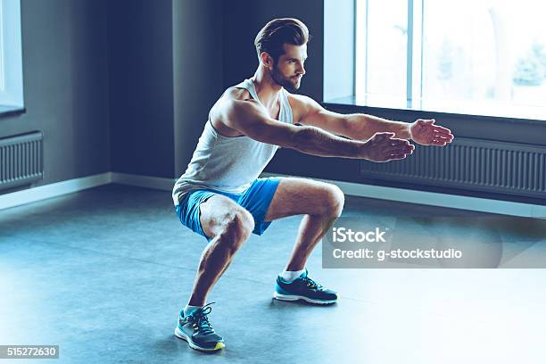 Perfect Squat Stock Photo - Download Image Now - Gym, Men, Arms Outstretched