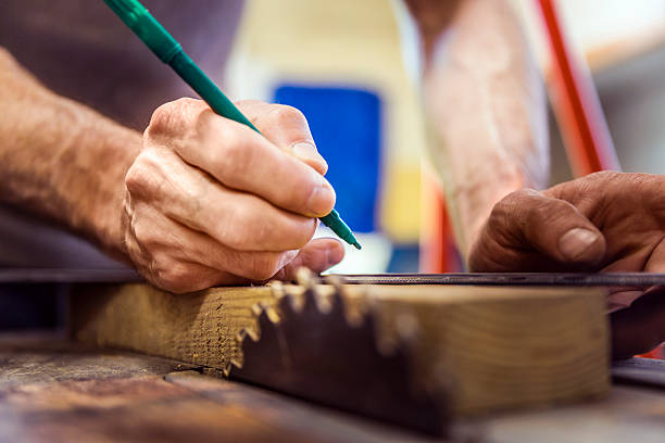 istock Carpenter marking on wooden plank at workplace 515273112