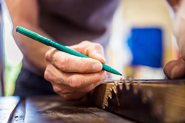 istock Carpenter marking on wooden plank at workplace 515273240