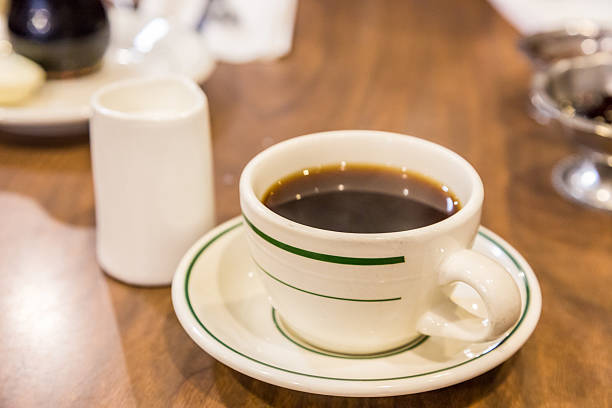 istock Cup of coffee on  breakfast table in cafe 515273854