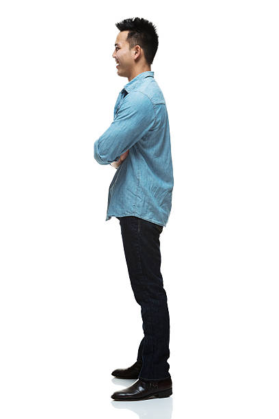 istock Smiling man standing with arms crossed 515274769