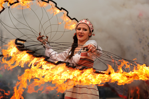 Orel, Russia - March 13, 2016: Maslenitsa, Pancake festival. Fire dancer performance selective focus