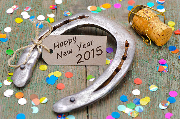 horseshoe as talisman for new year 2015 horseshoe as talisman for new year 2015 with cork of champagne horseshoe horse luck good luck charm stock pictures, royalty-free photos & images