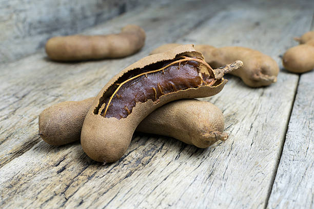 istock tamarind on grunge wooden background 515276568