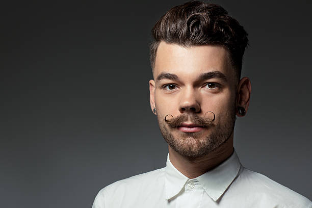 istock portrait of young man with long moustaches 515276899