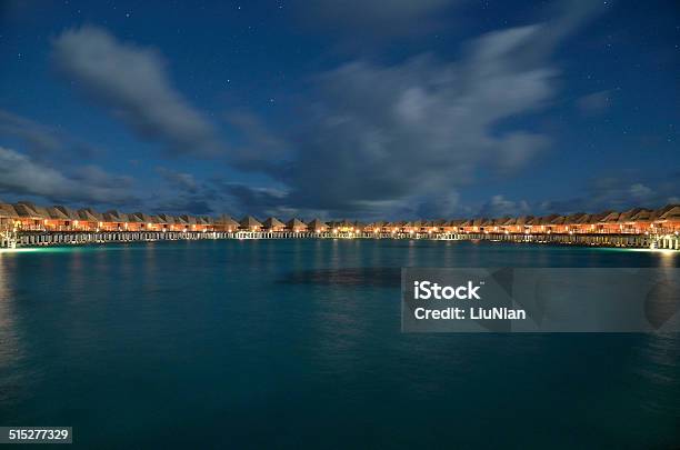 Overwater Holiday Villas On The Tropical Lagoon At Night Stock Photo - Download Image Now