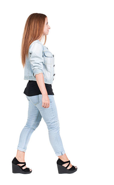 istock back view of walking  woman. 515277555