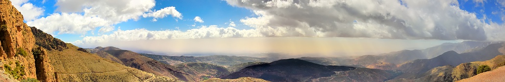 At Tizi n'Test on Route 203, halfway between Marrakech and Agadir, the La Belle Vue overlooks this spectacular Atlas Mountain panoramic view with rain falling from a sub-layer of clouds