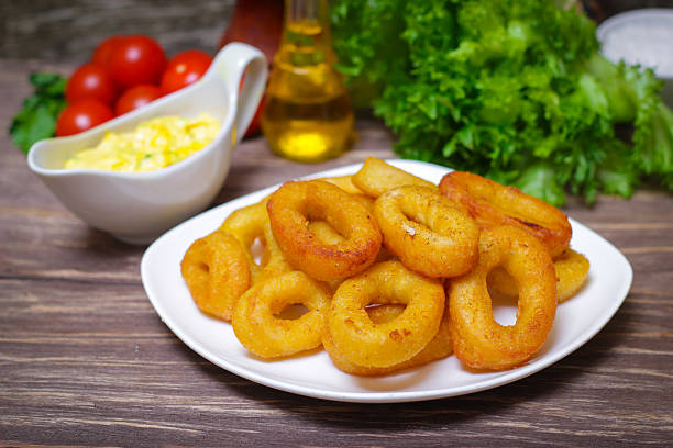 istock deep fried calamari with sauce and salad 515277690