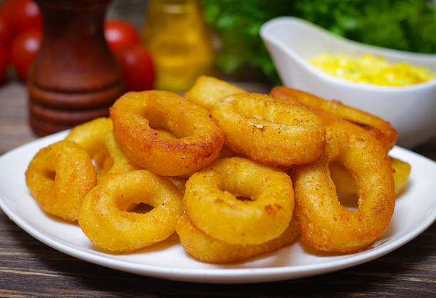 istock deep fried calamari with sauce and salad 515278082