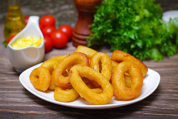 istock deep fried calamari with sauce and salad 515278292