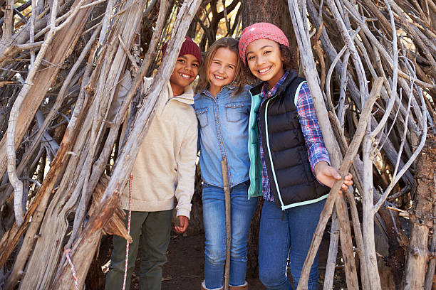 istock Group Of Children Playing In Forest Camp Together 515278432