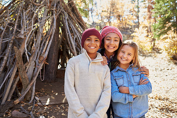 istock Group Of Children Playing In Forest Camp Together 515278434