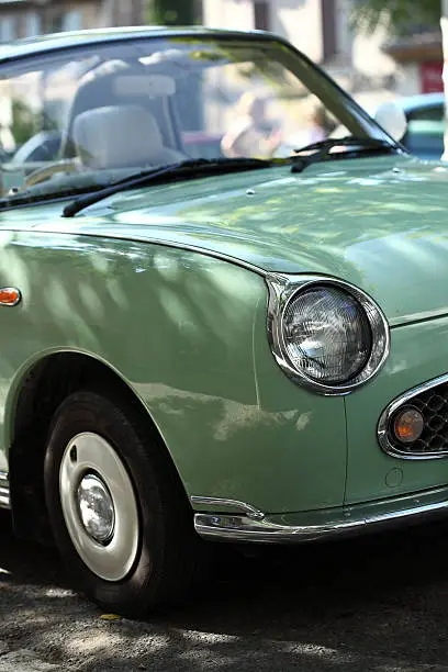 Detail of a green Nissan Figaro