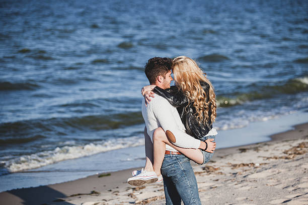 istock happy couple  at the beach 515278939