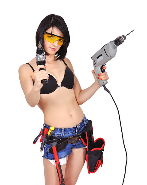 istock girl with two electric drill 515279335