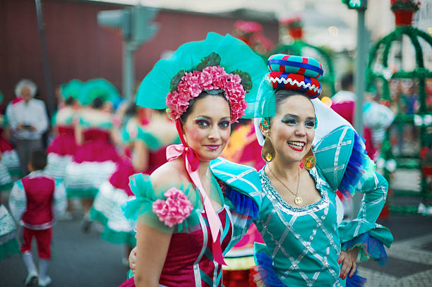 Lisbon, Portugal - June 12, 2014: A couple of women dressed in historical costumes, wait for their turn to parade in Lisbon downtown, during the celebrations of Lisbon Popular Saints.