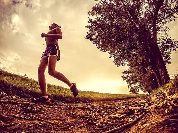 istock Young woman jogging in nature 515280757