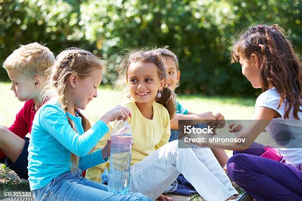 Circle Of Friends Stock Photo - Download Image Now - Bottle, Boys, Casual Clothing