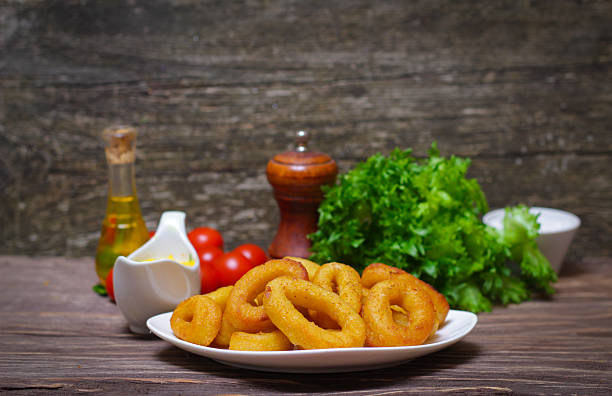 istock deep fried calamari with sauce and salad 515306482