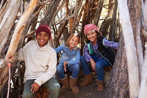 istock Group Of Children Playing In Forest Camp Together 515306520