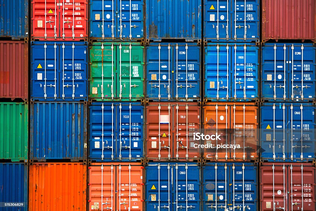 Four vertical rows of shipping containers Four vertical rows of shipping containers that are different colors in the Port of Zeebrugge, Belgium Container Stock Photo