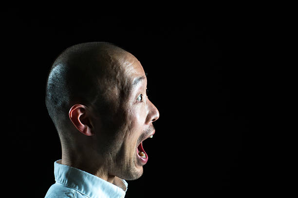 Profile view of a Japanese man looking surprised