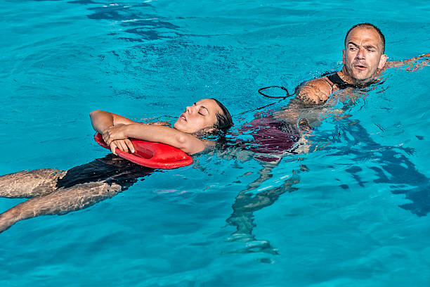 istock Lifeguard rescuing young woman 515308221