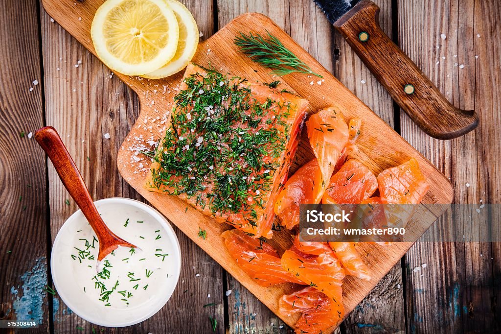 homemades gravlax with dill homemade smoked salmon with dill on a wooden table Gravlax Stock Photo