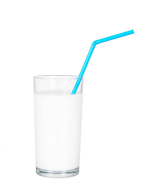istock Glass of fresh milk with blue drinking straw. Isolated. 515310123