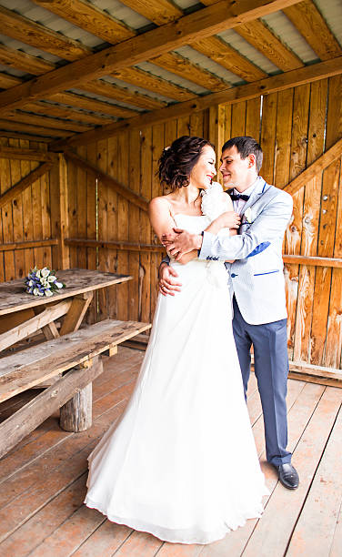 istock wedding pair hugging and kissing 515310390