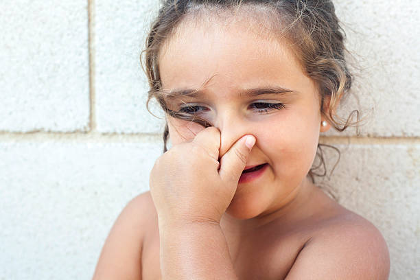 istock Girl touching her nose. 515311472