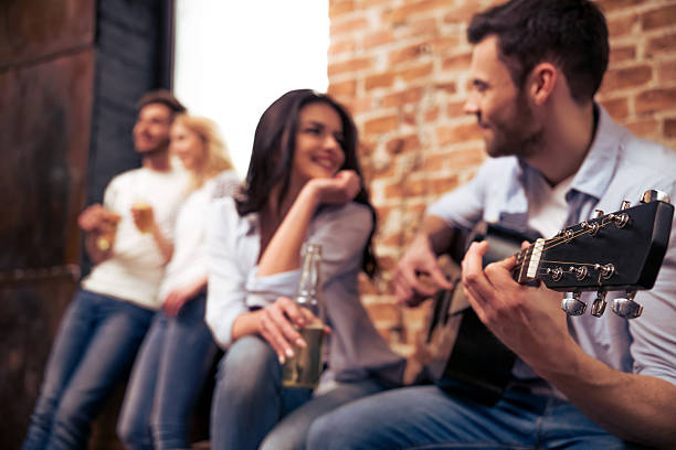 istock Young company playing guitar 515311764