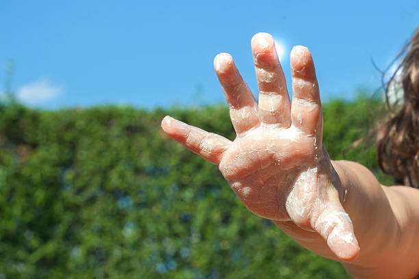 istock Girl applying lotion. 515312456