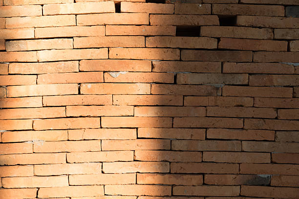 istock sunlight on some part of brick wall for background 515313688