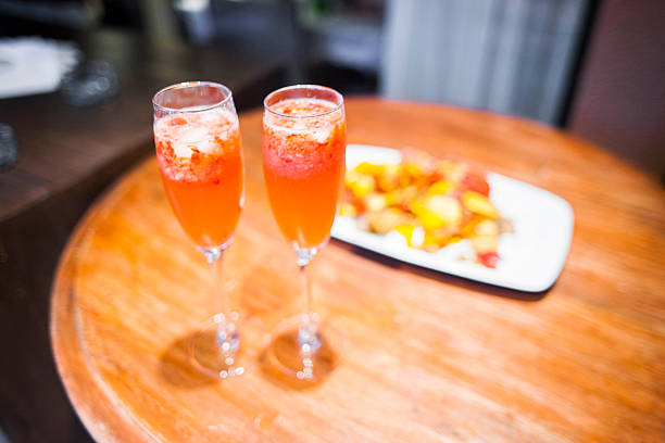 istock two glasses of champagne with strawberries and chips 515314464