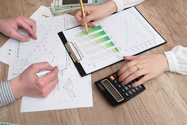 istock business partners looking at business document 515314700