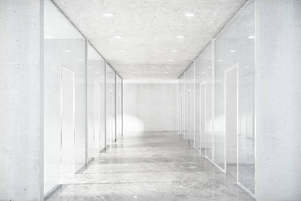 istock Long corridor with concrete floor and transparent walls in moder 515315128