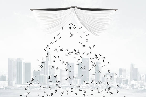 istock Letters fall from the book at city background 515315364