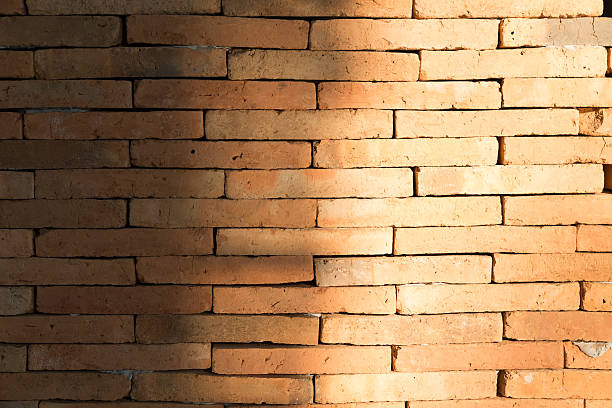 istock sunlight on some part of brick wall for background 515315396