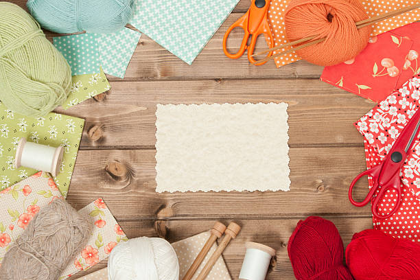 istock Sewing And Knitting Accessories. Fabric, Yarn Balls. Wooden Tabl 515315580