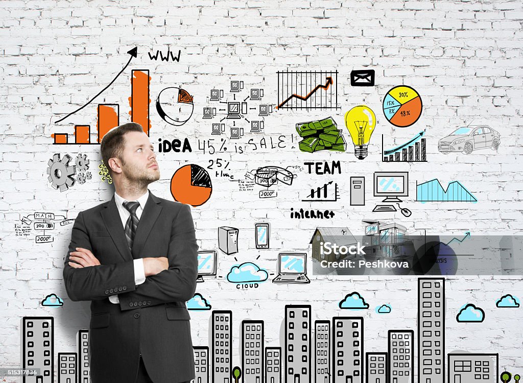 businessman businessman leaning against a brick wall  with drawing chart Adult Stock Photo