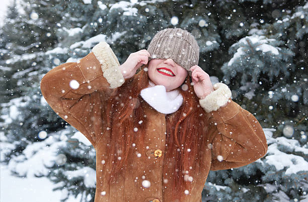 istock Winter woman blinded snow on head 515320658