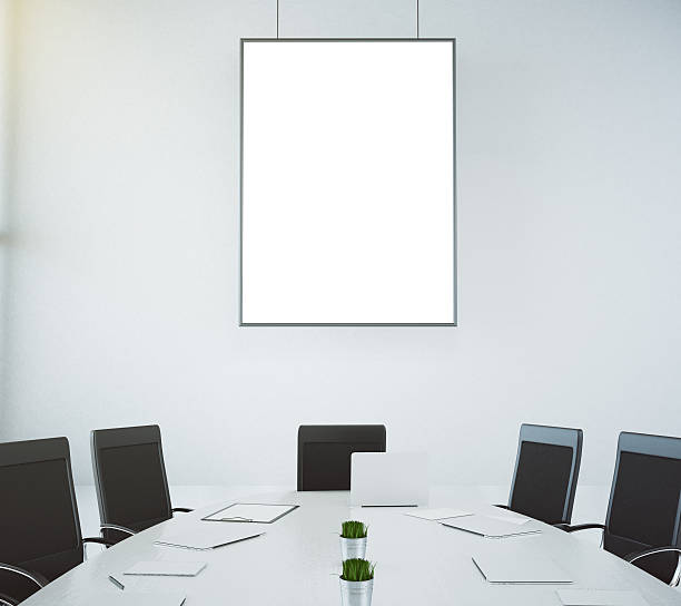 istock Meeting room with table and chairs and blank picture frame 515322056