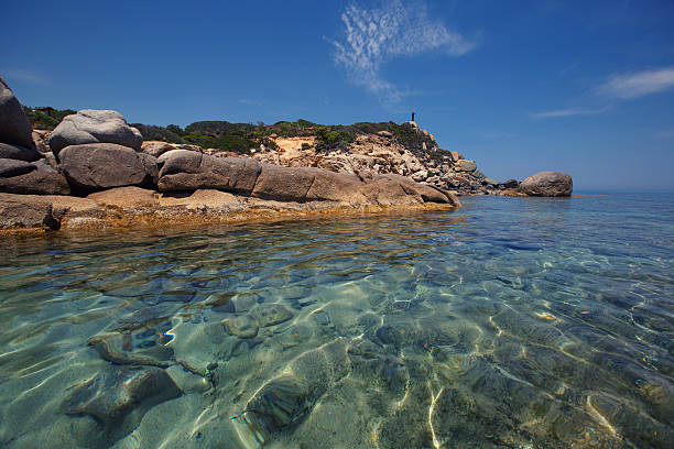 Rocks at Cala Sinzias beach and sea view, Sardinia island, Italy