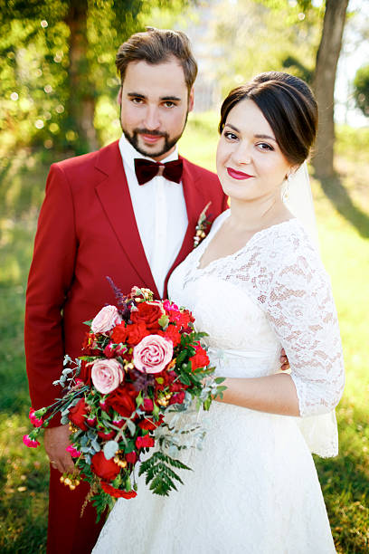 Portrait of newlyweds couple outdoors, summer stock photo