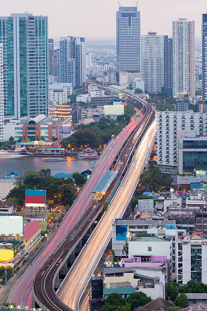 istock Aerial view long exposure city road bridge cross main river 515366774