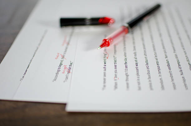 Red pen editing a manuscript Red pen editing a manuscript editor stock pictures, royalty-free photos & images
