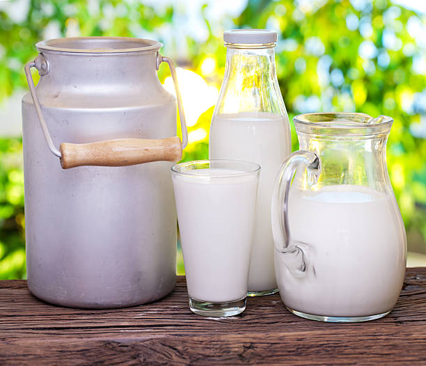 istock Milk in the various dishes on the old wooden table. 515369658